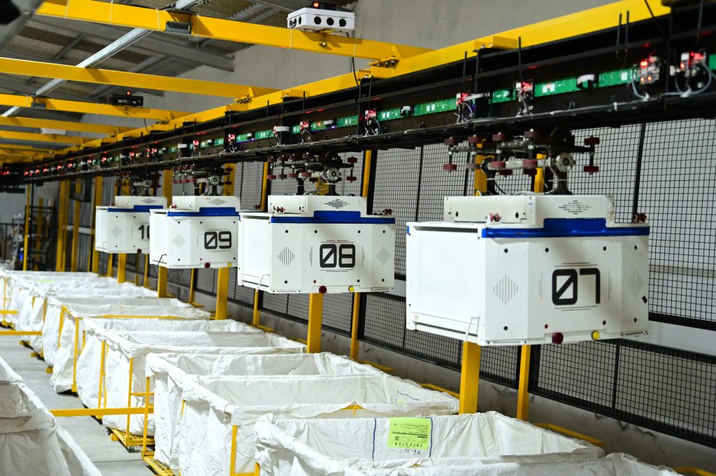 mSort automated sorting system used for package sorting and material handling in warehouse operations.