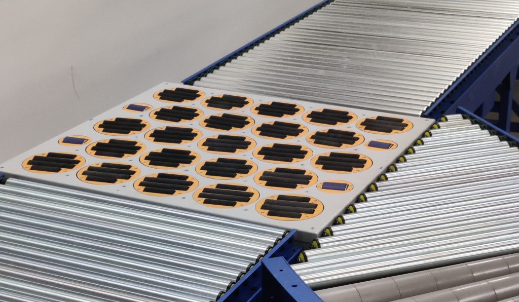 Swivel sorter conveyor system with multiple rotating wheel modules for package sorting and material handling.